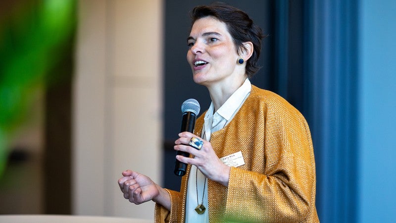 woman speaking into a microphone